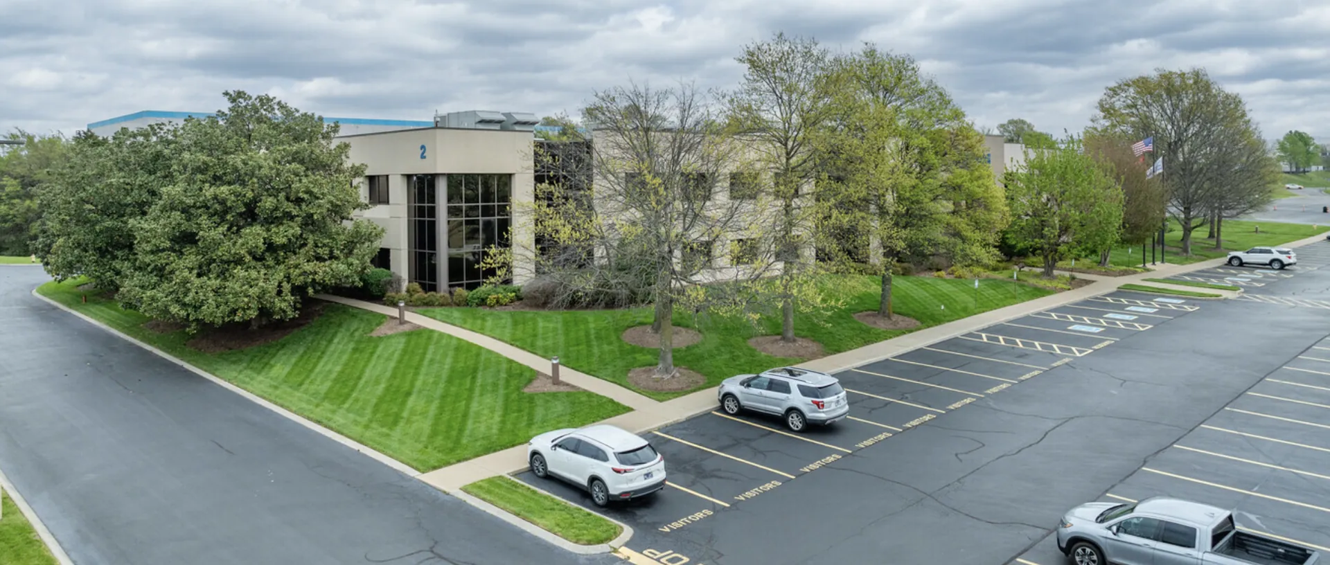 Aerial view of the American Classical Academy Rutherford campus building and parking lot
