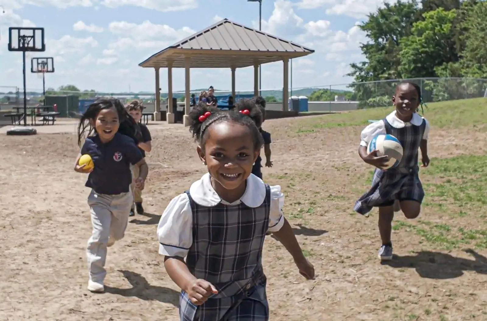 ACAR students running outside on the school field